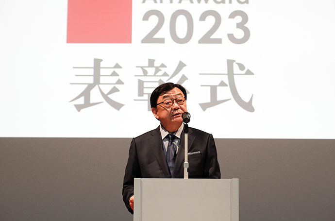 President Kifuji giving a speech to the host